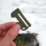 Clip-On Snowboard Goggle Scraper with Bottle Opener